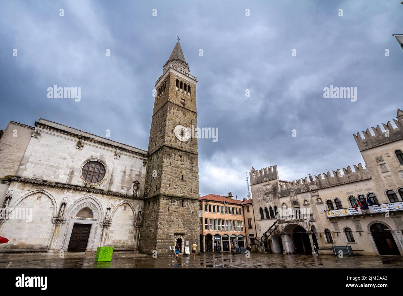 Picture of the tito square in Koper, Slovenia, with the cathedral of the assumption and the praetorian palace. The Cathedral of the Assumption of the Stock Photo
