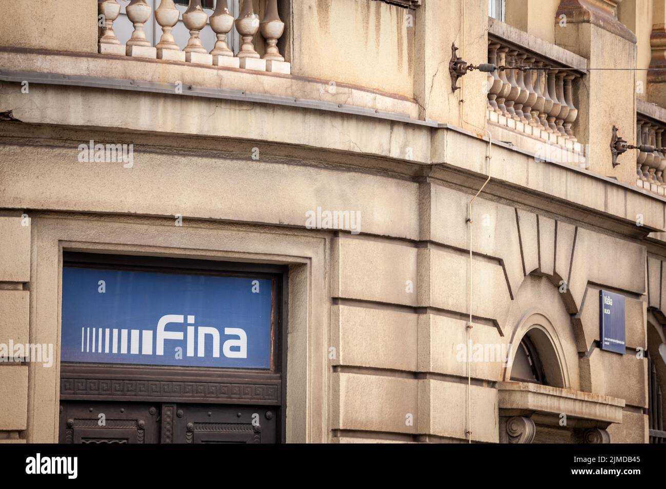 Picture of a sign with the logo of Fina Croatia on their main office in Zagreb, Croatia. Fina, or Financijska Agencija, also called Financial agency, Stock Photo
