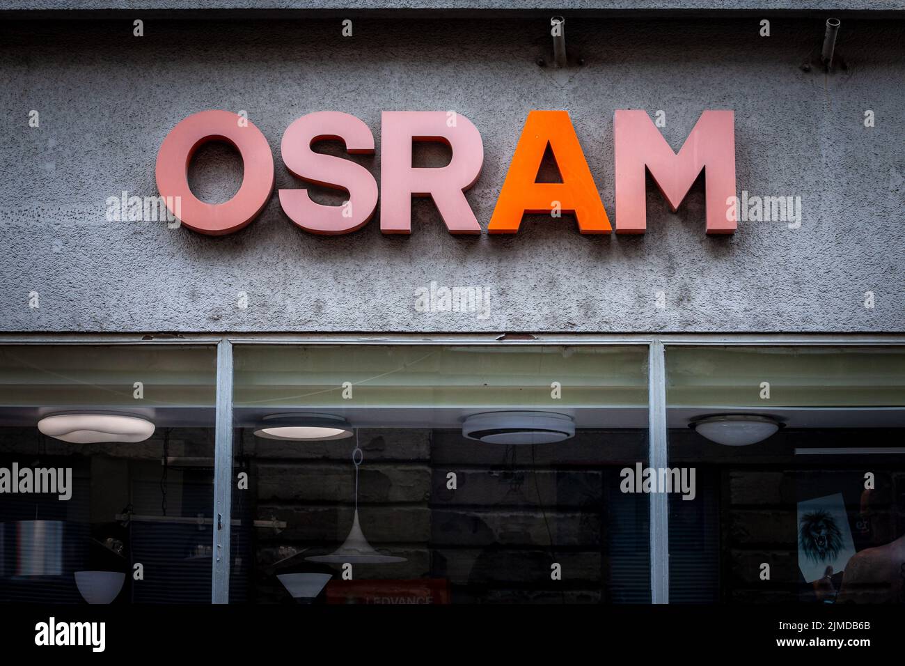 Picture of a sign with the logo of Osram on their retailer in Zagreb, Croatia. Osram Licht AG (stylized as OSRAM) is a German company that makes elect Stock Photo