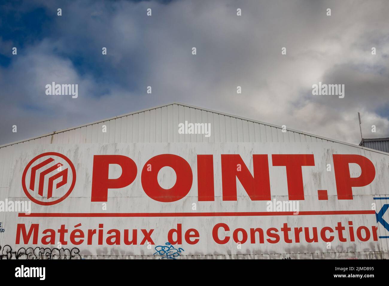Picture of a sign with the logo of Point P in front of their main store for Bordeaux, France. Point P is a French construction material supplies retai Stock Photo