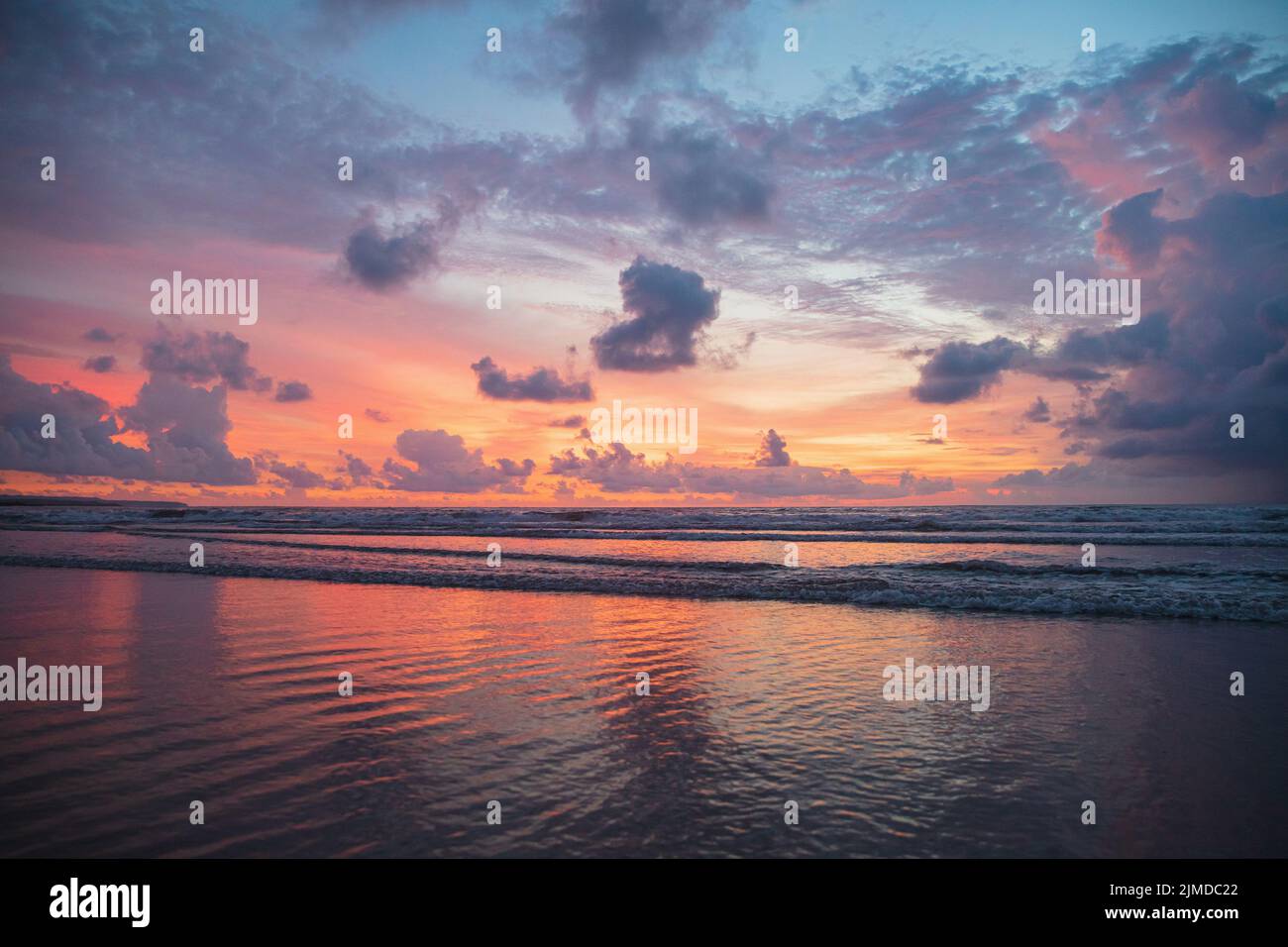 Fiery red sunset view on Kuta beach Stock Photo