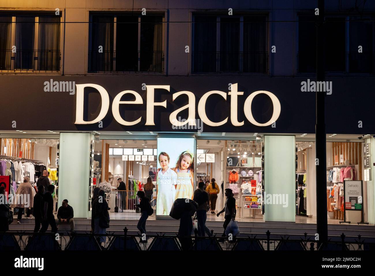 Picture of a sign with the logo of Defacto taken on their shop for Istanbul, Turkey. DeFacto is a clothing retailer company. Defacto is a Turkish mult Stock Photo