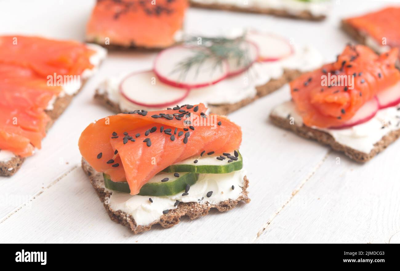 Canapes with salmon and vegetables Stock Photo