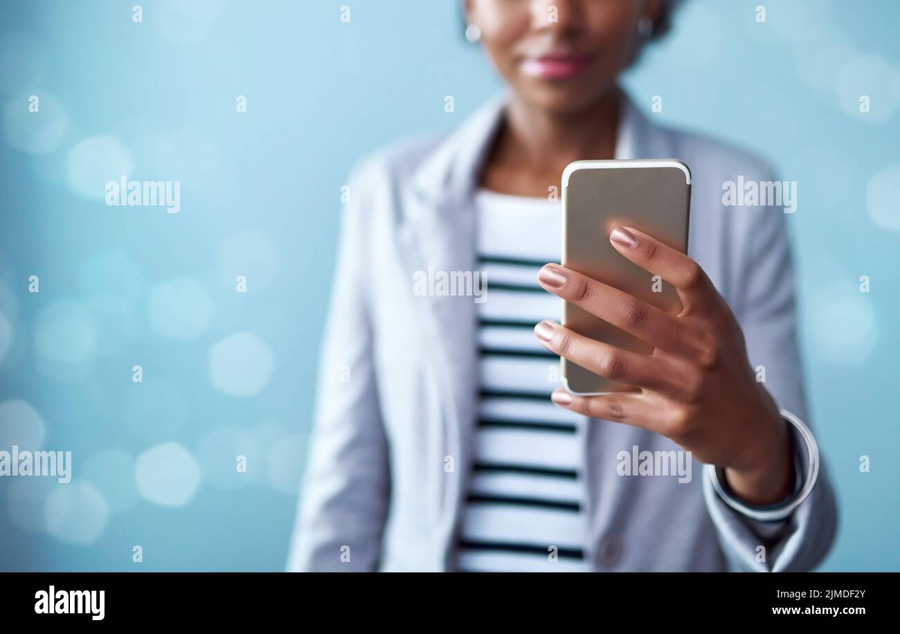 Technology, phone and hand of a professional woman typing a message, browsing the internet or using mobile app. Closeup of female using technology and Stock Photo