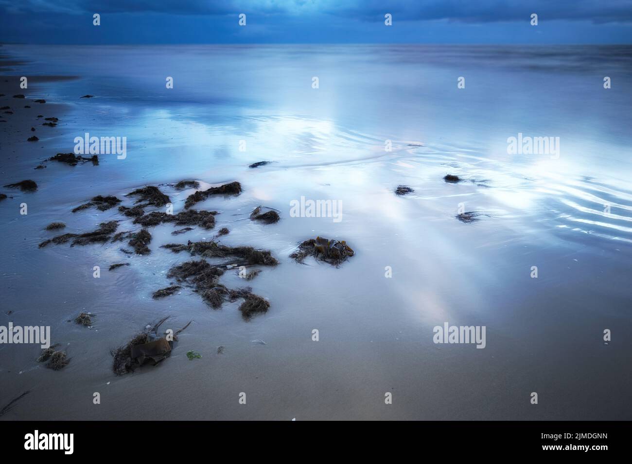 A photo of beautiful sunset at the beach Stock Photo - Alamy