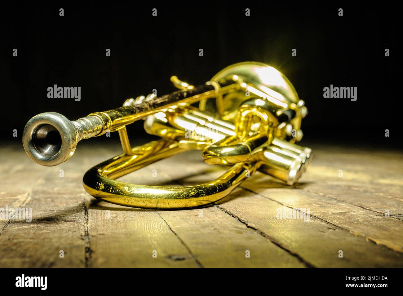 Brass instrument - trumpet on stage with backlight Stock Photo