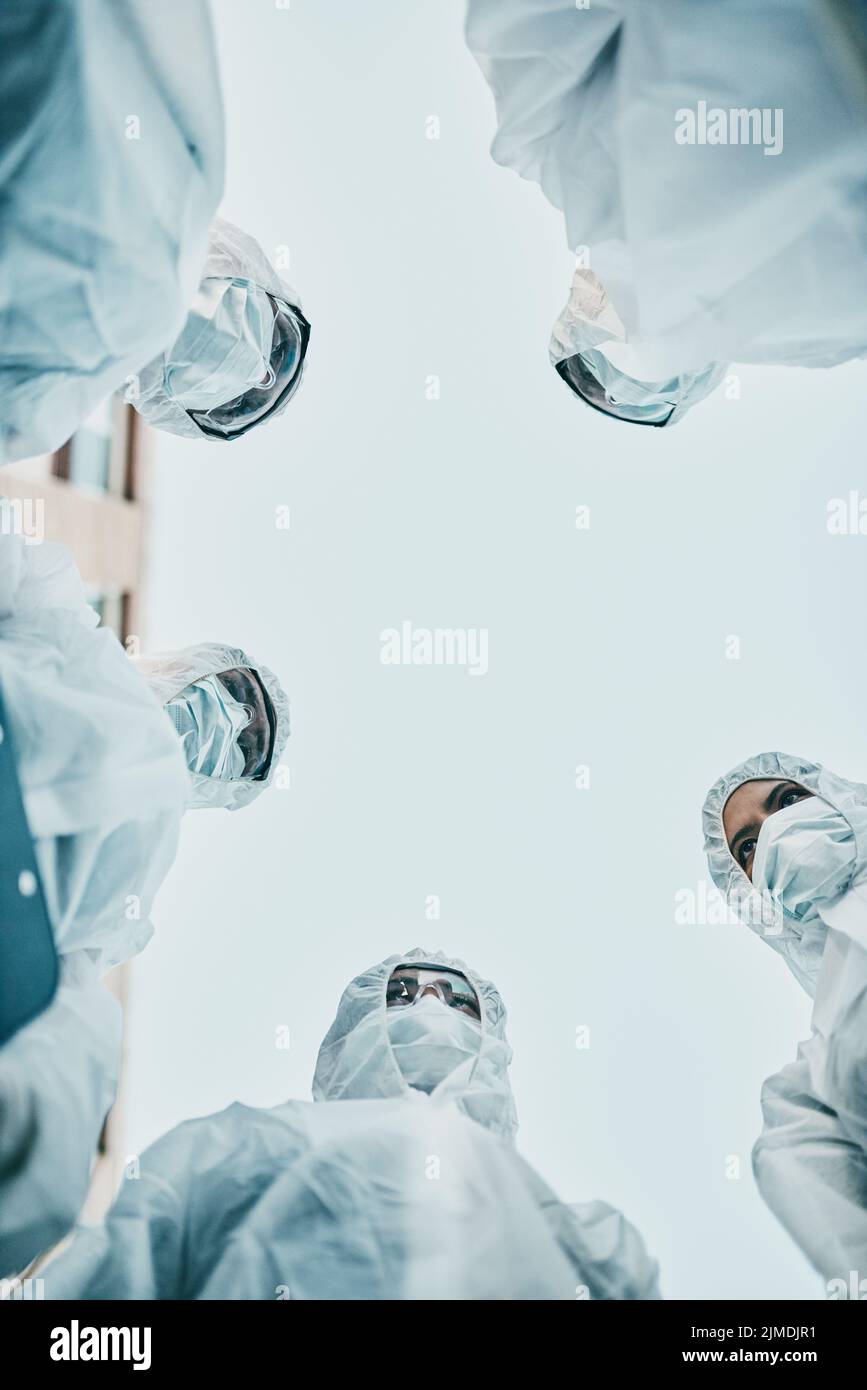 Safe, secure and covered group of healthcare workers wearing masks and