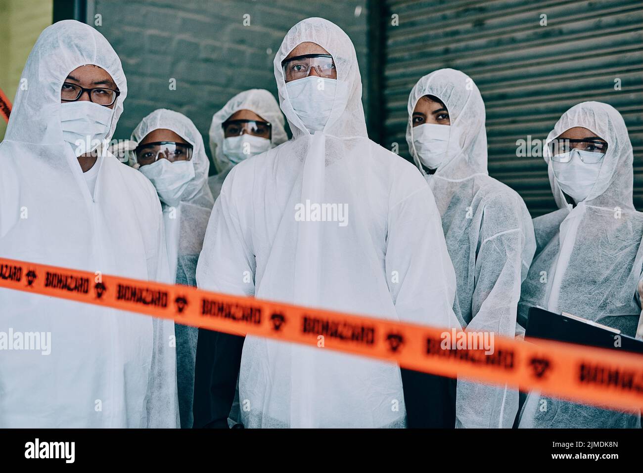 Covid, pandemic and team doctors, scientists or heathcare workers wearing protective ppe to prevent virus spread at a quarantine site. First Stock Photo