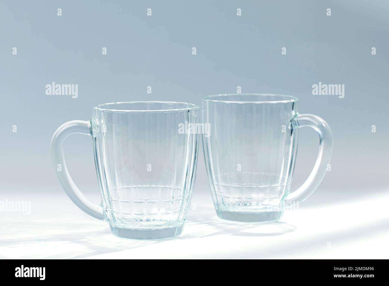 Empty beer mug on grey background. Stock Photo