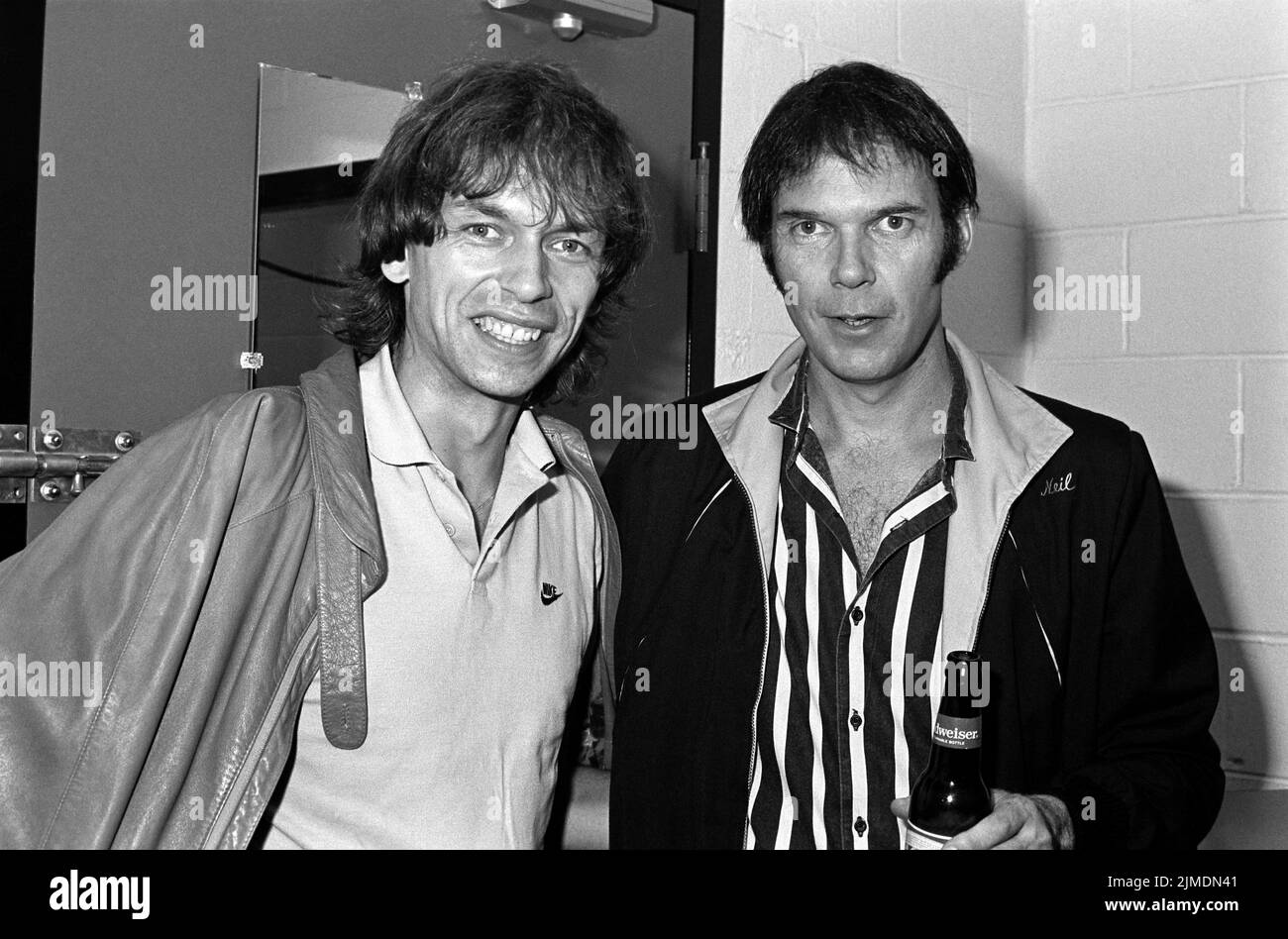 Steve Howe of Yes backstage with Neil Young after Young and the Shocking Pinks' gig at the Spectrum in Philadelphia, PA. August 28, 1983.Credit: Scott Weiner/MediaPunch Stock Photo