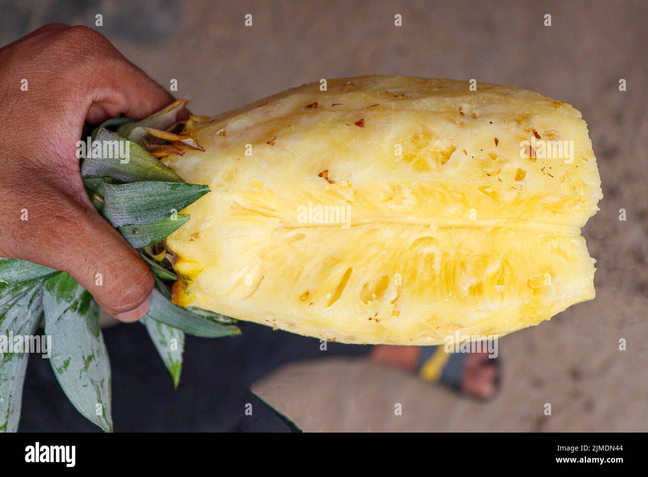 tasty and healthy ripe pineapple without peel on juice shop for sell