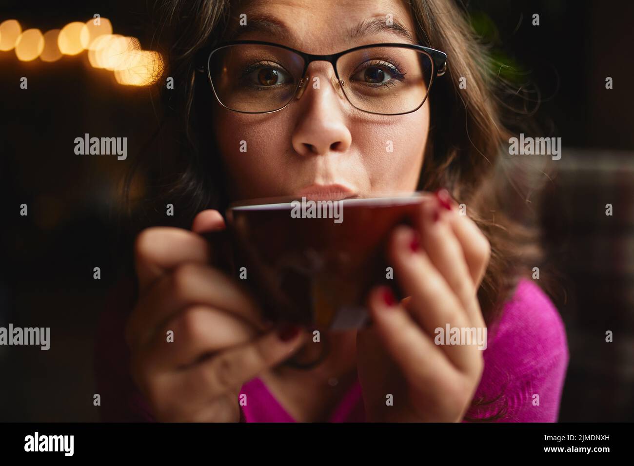 Beautiful lady wearing glasses and looking at camera Stock Photo