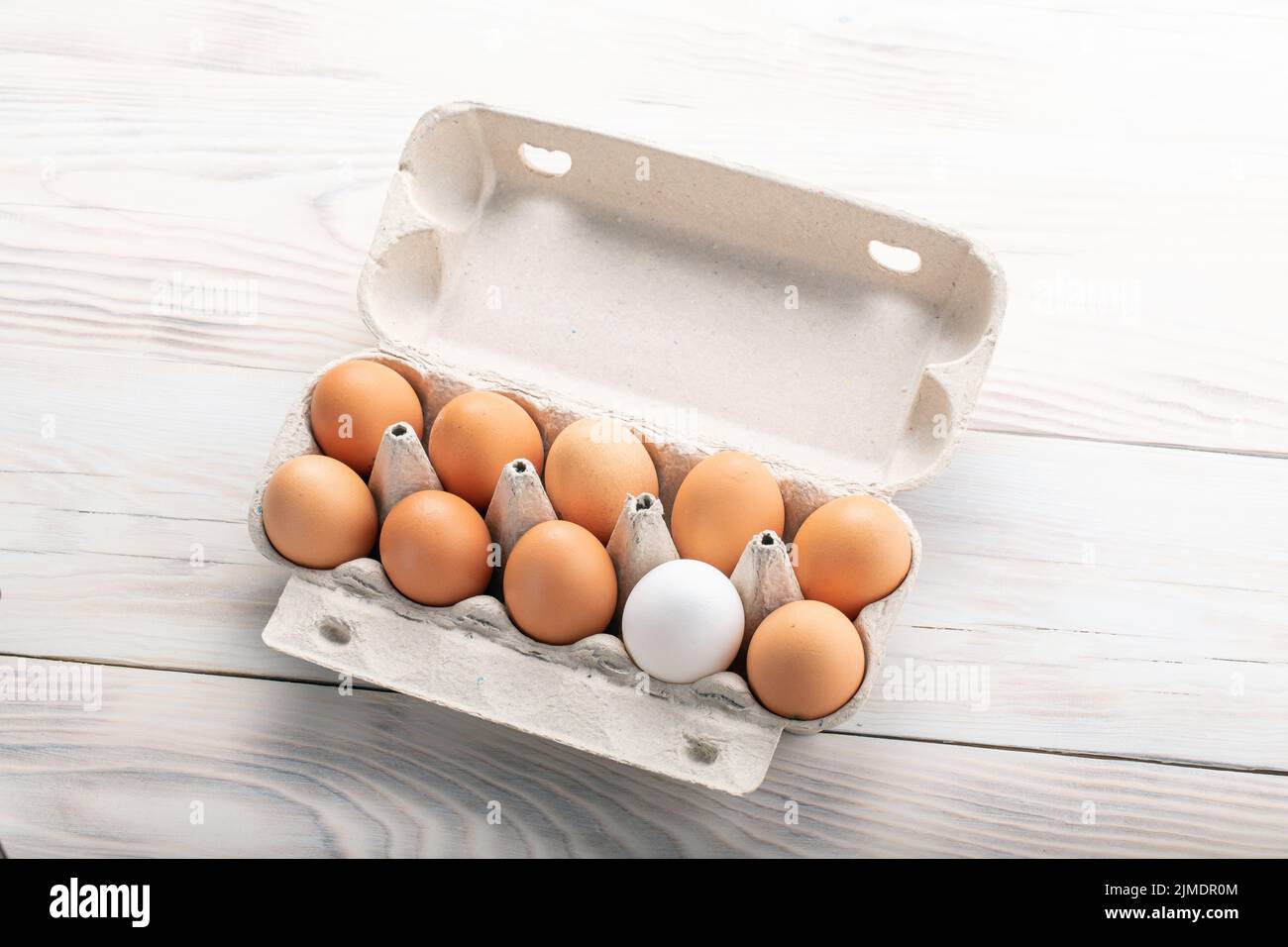 One white egg surrounded brown hi-res stock photography and images - Alamy