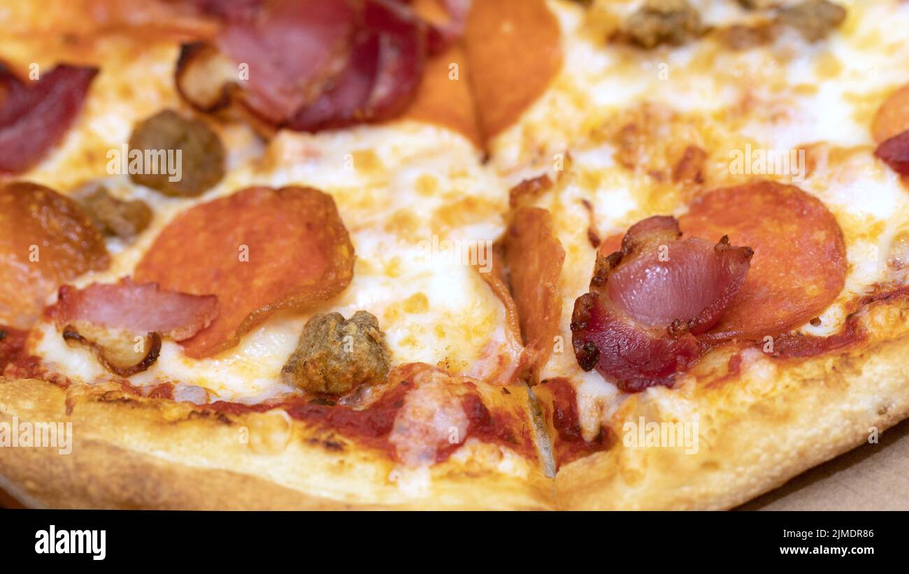 Pizza with salami, ham, beef Stock Photo Alamy