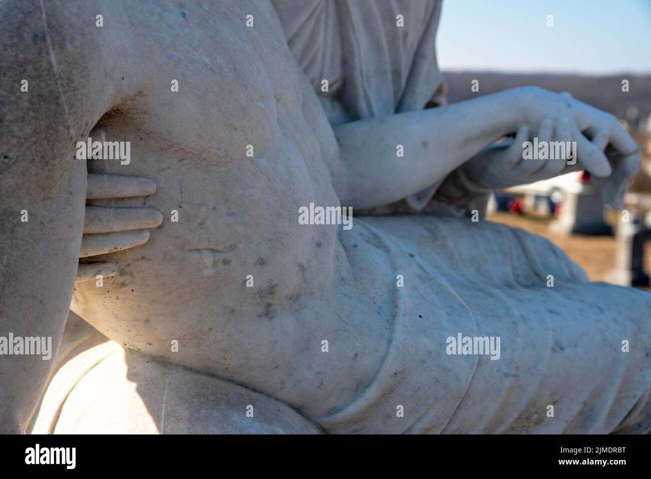 Mary cradles Jesus in stone pieta statue Stock Photo