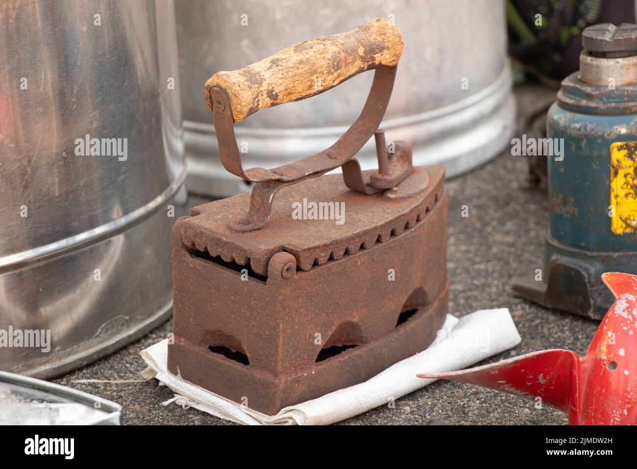 old rusty iron for hot coals, vintage iron for ironing clothes, dry cleaning and laundry, antiques Stock Photo