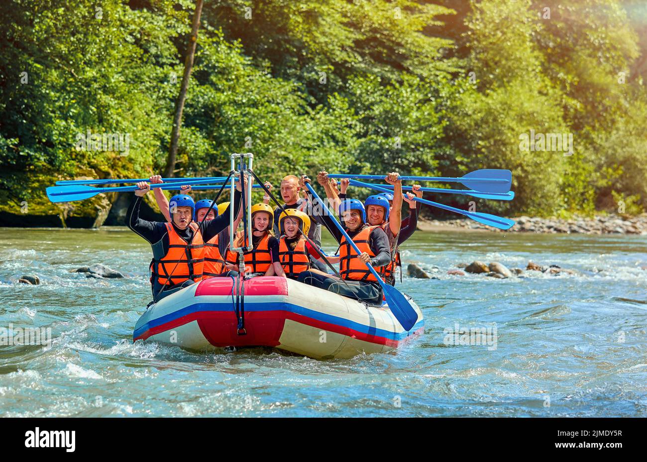 cheerful team is rafting on a mountain river Stock Photo