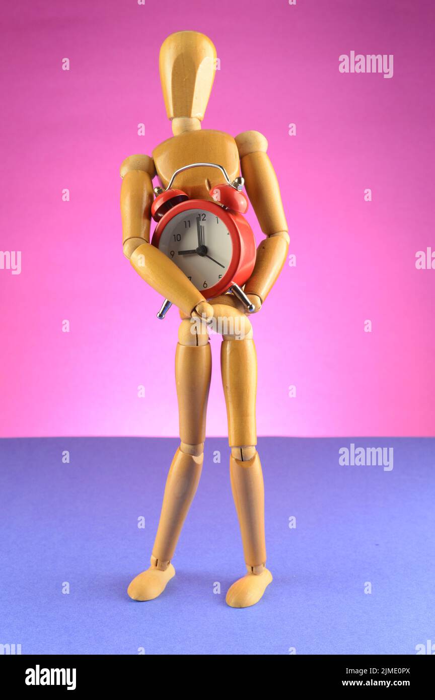 Artist Mannequin Holds a Clock Stock Photo Alamy