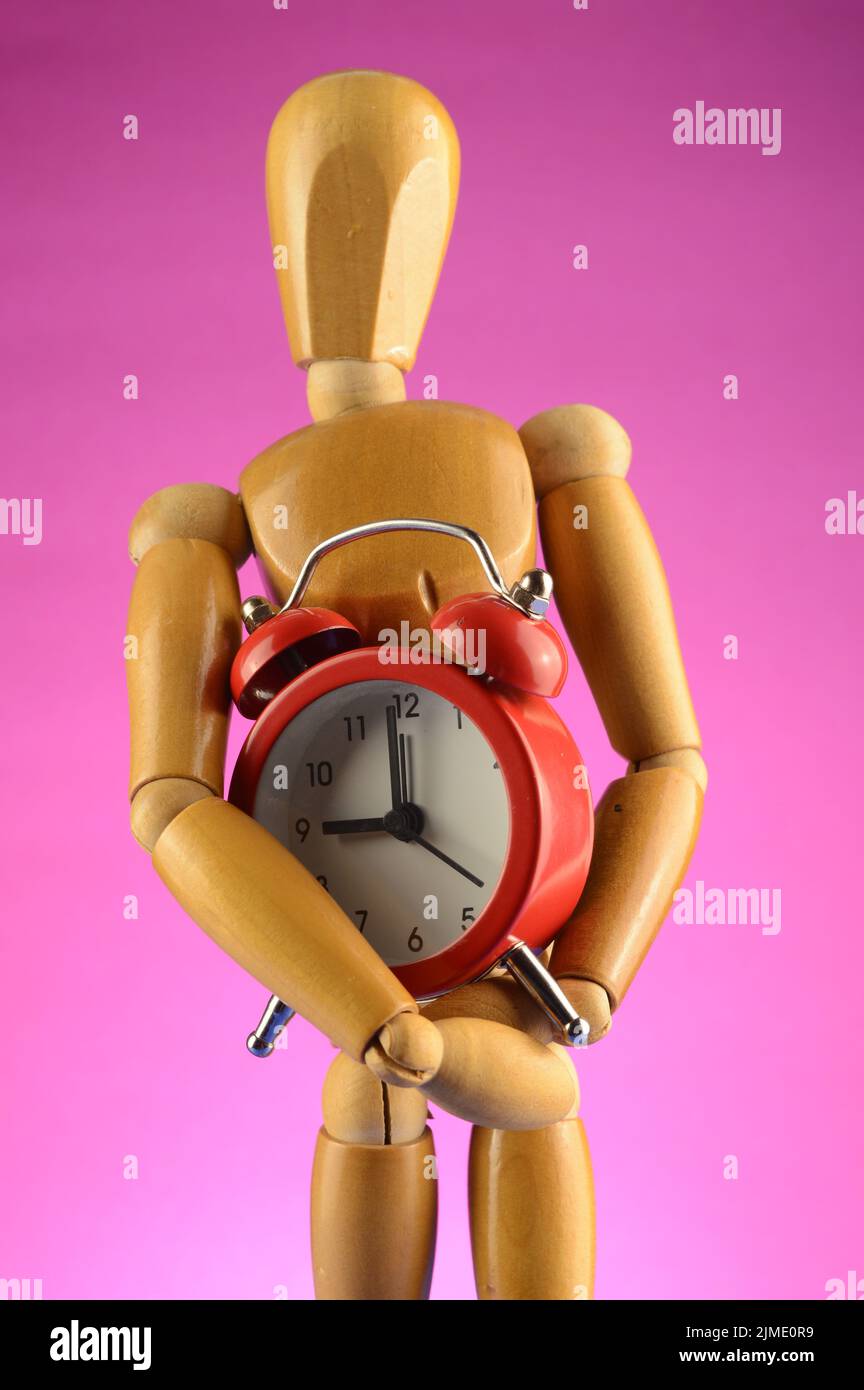 Artist Mannequin Holds a Clock Stock Photo Alamy