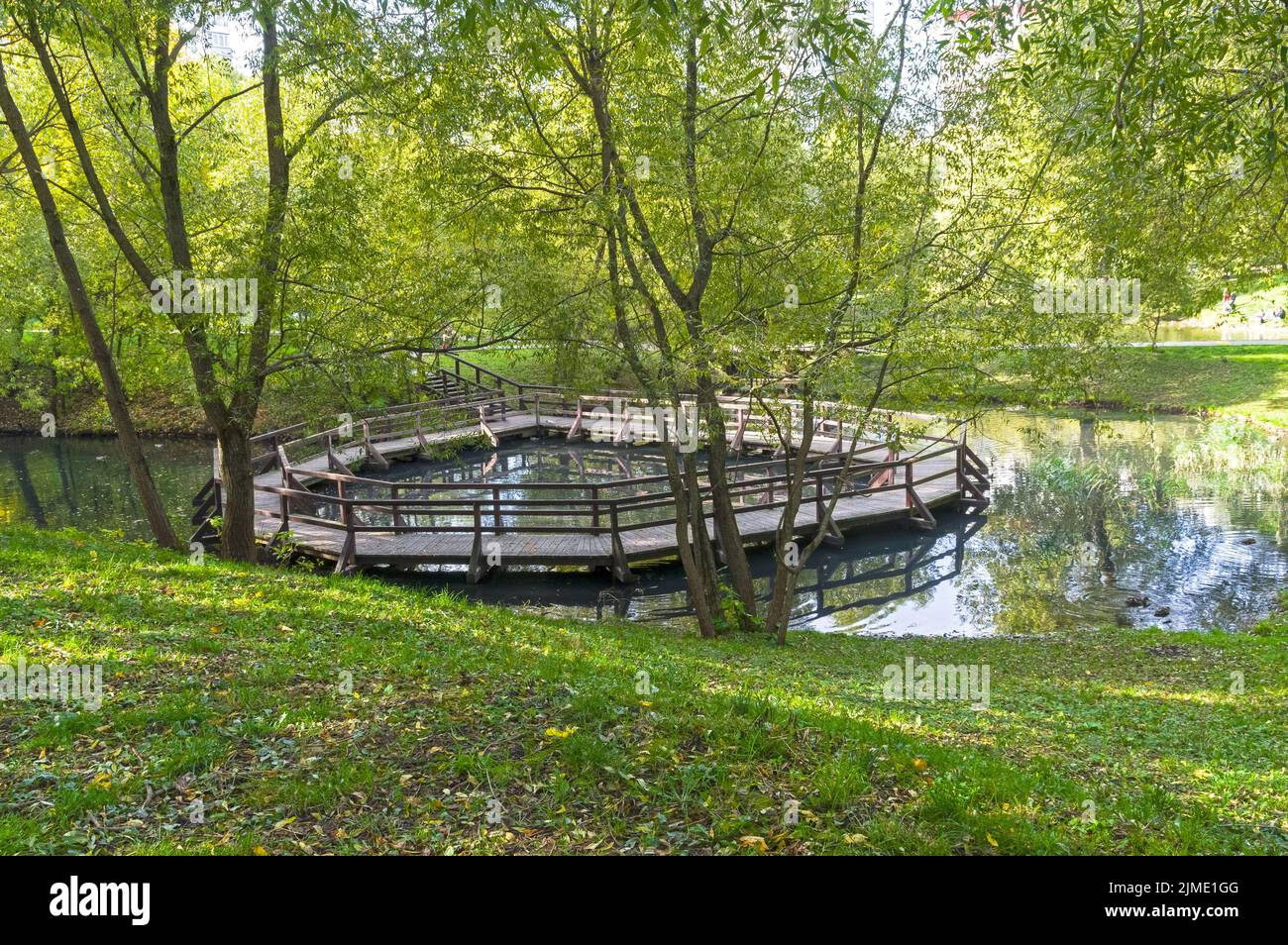 Unusual ring bridge on a small pond Stock Photo Alamy