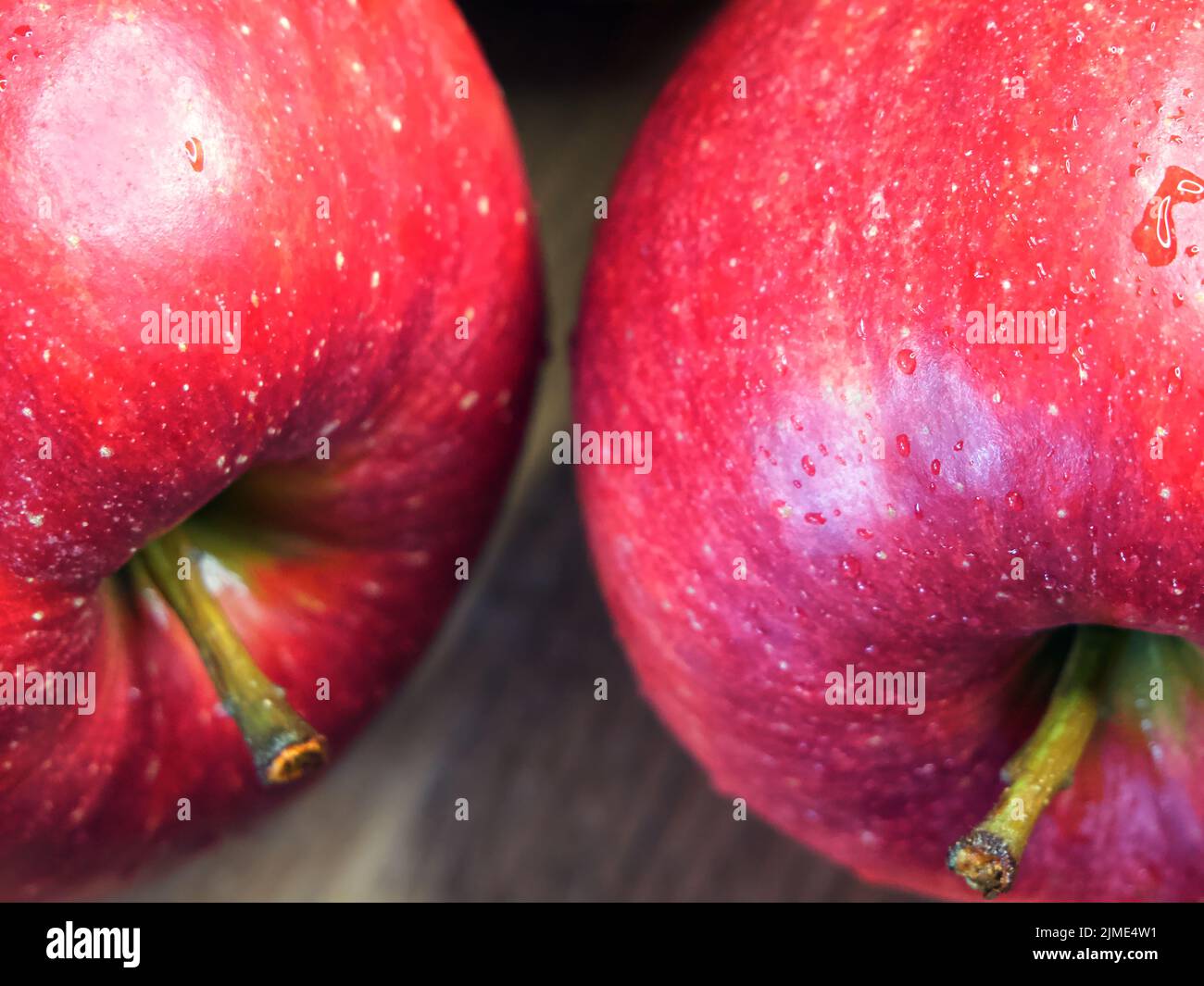 Delicious red apples photographed in macro. Ripe fruit. Juicy Red Apple Stock Photo