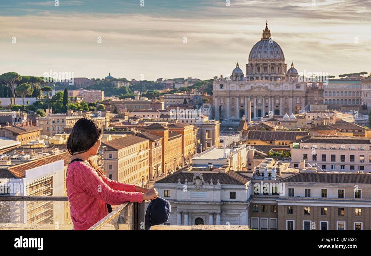 Rome Vatican Italy high angle view sunset city skyline with woman tourist Stock Photo