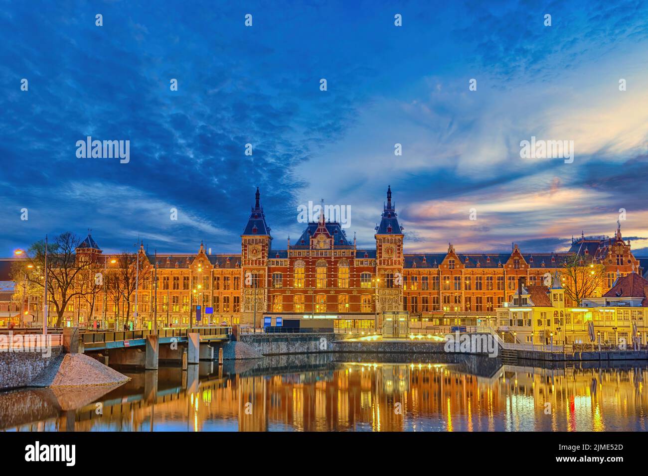 Amsterdam Netherlands, night city skyline at Amsterdam Central Station Stock Photo