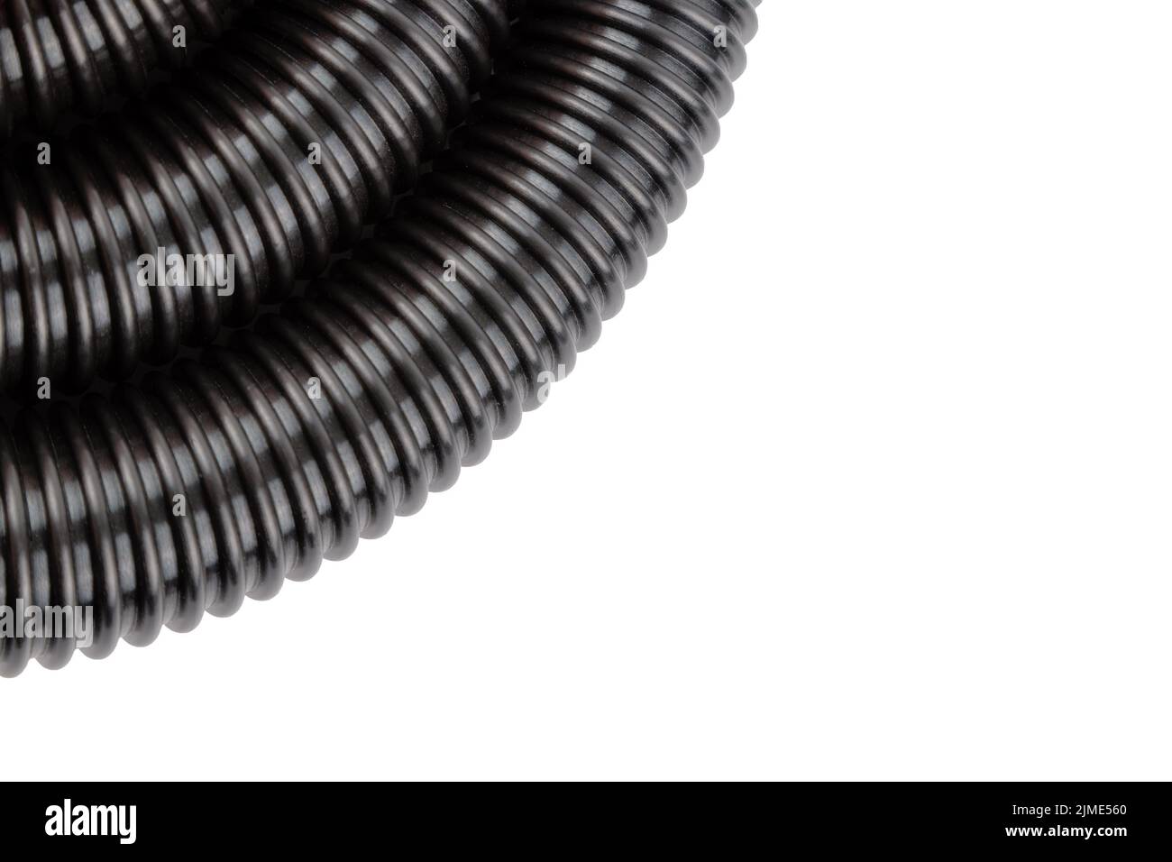 black plastic corrugated vacuum cleaner hose on white background Stock