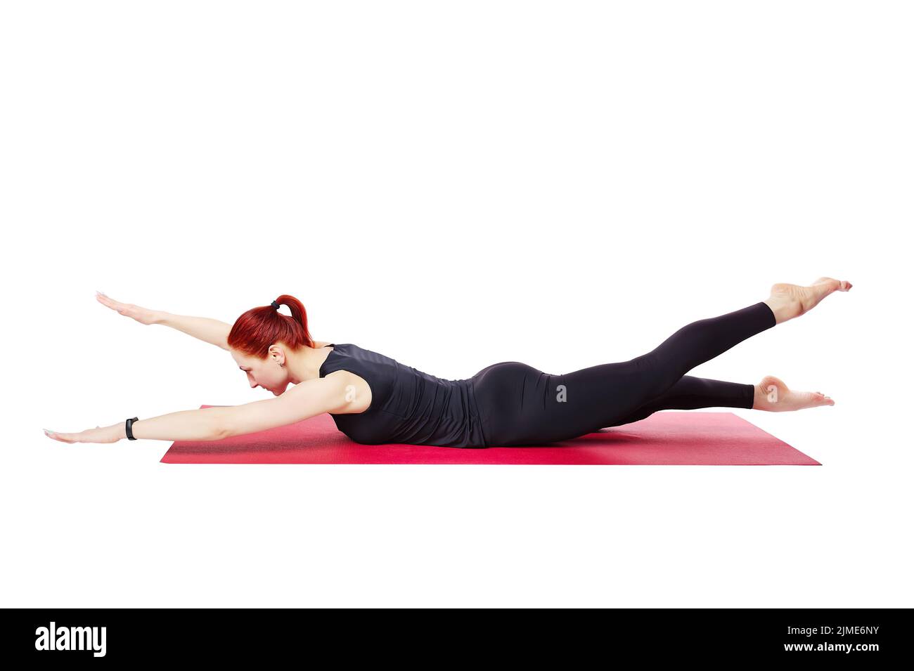 Pilates or yoga. A slender athletic girl performs an exercise to