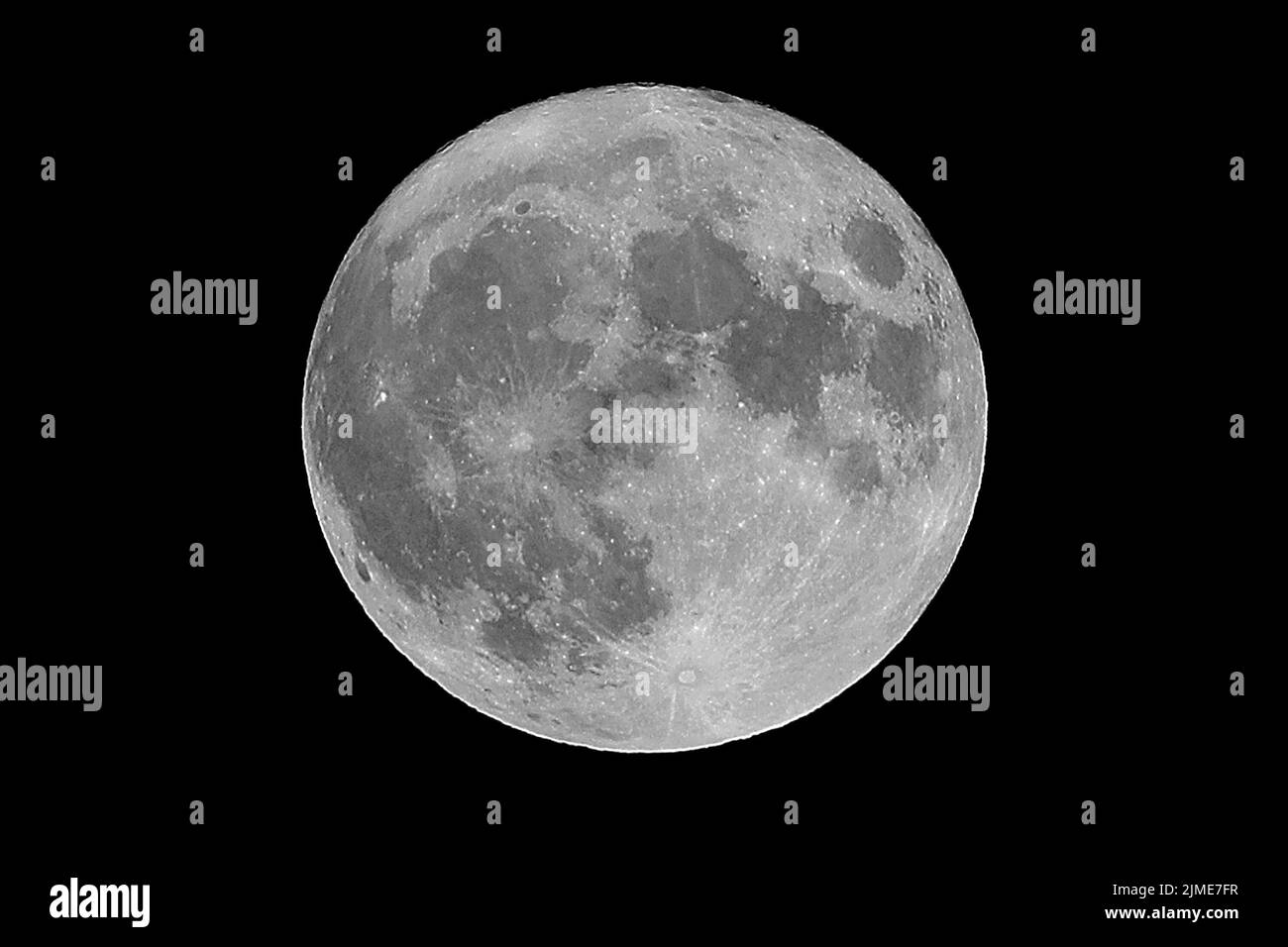 huge super full moon that you can see well even the craters at night Stock Photo