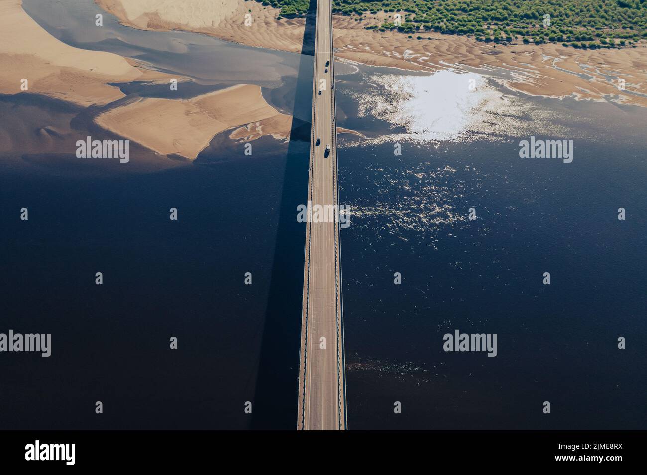 Aerial view of bridge over river in sunset light Stock Photo - Alamy