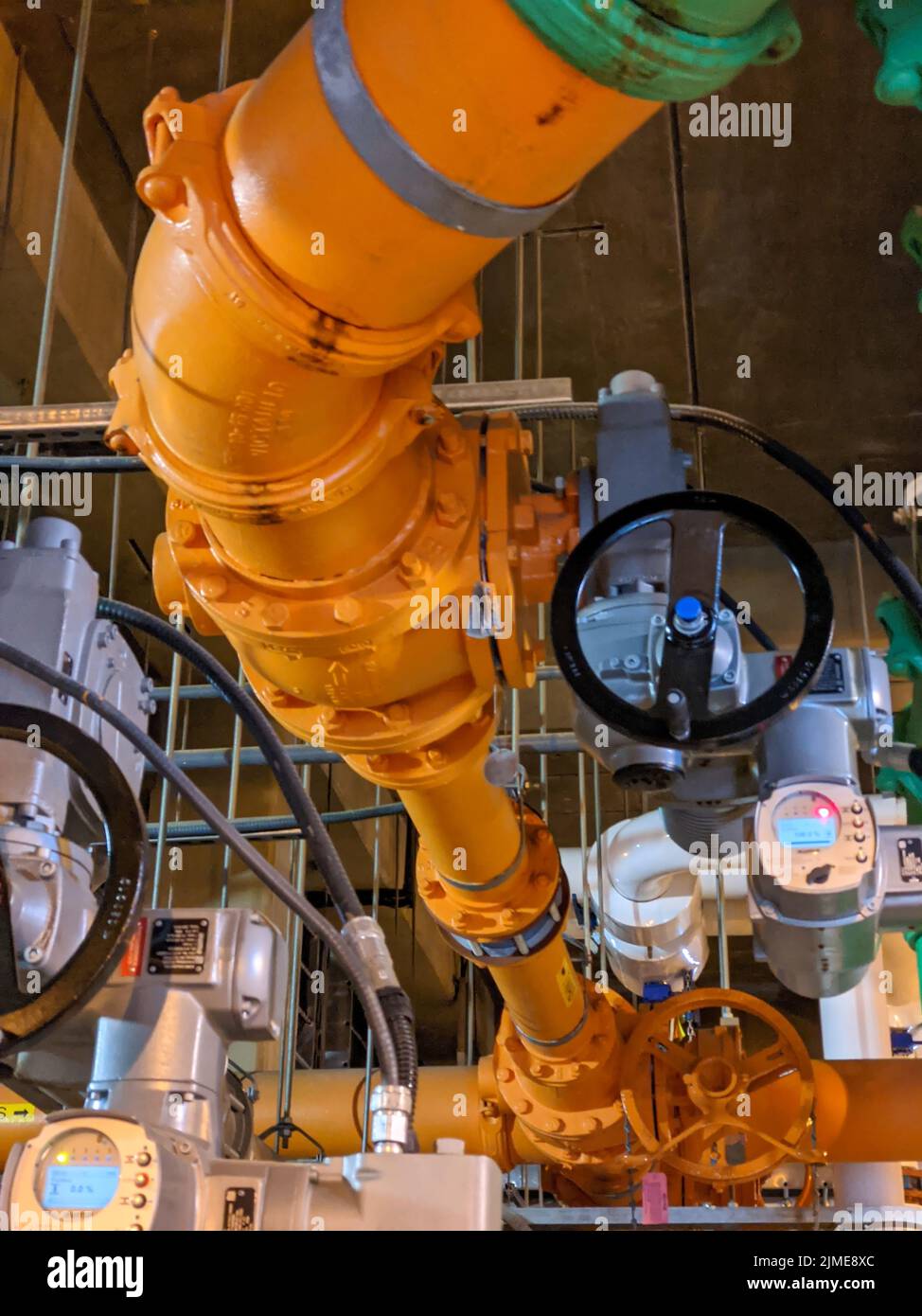 Pipes and sewage pumps at industrial wastewater treatment plant Stock