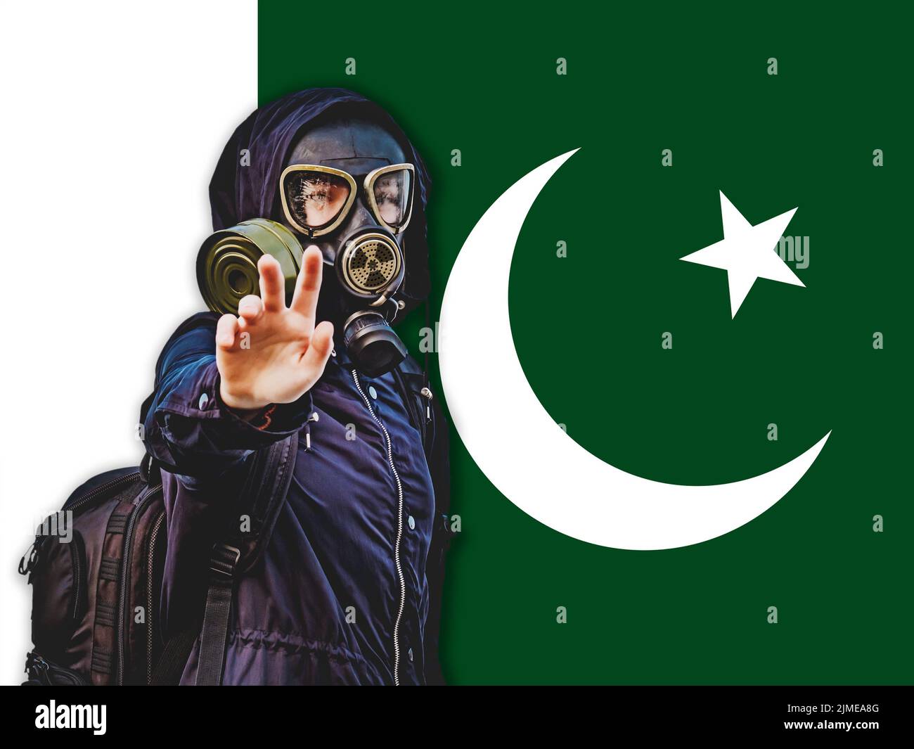 Girl In A Black Gas Mask Against The Background Of The Flag Of Pakistan