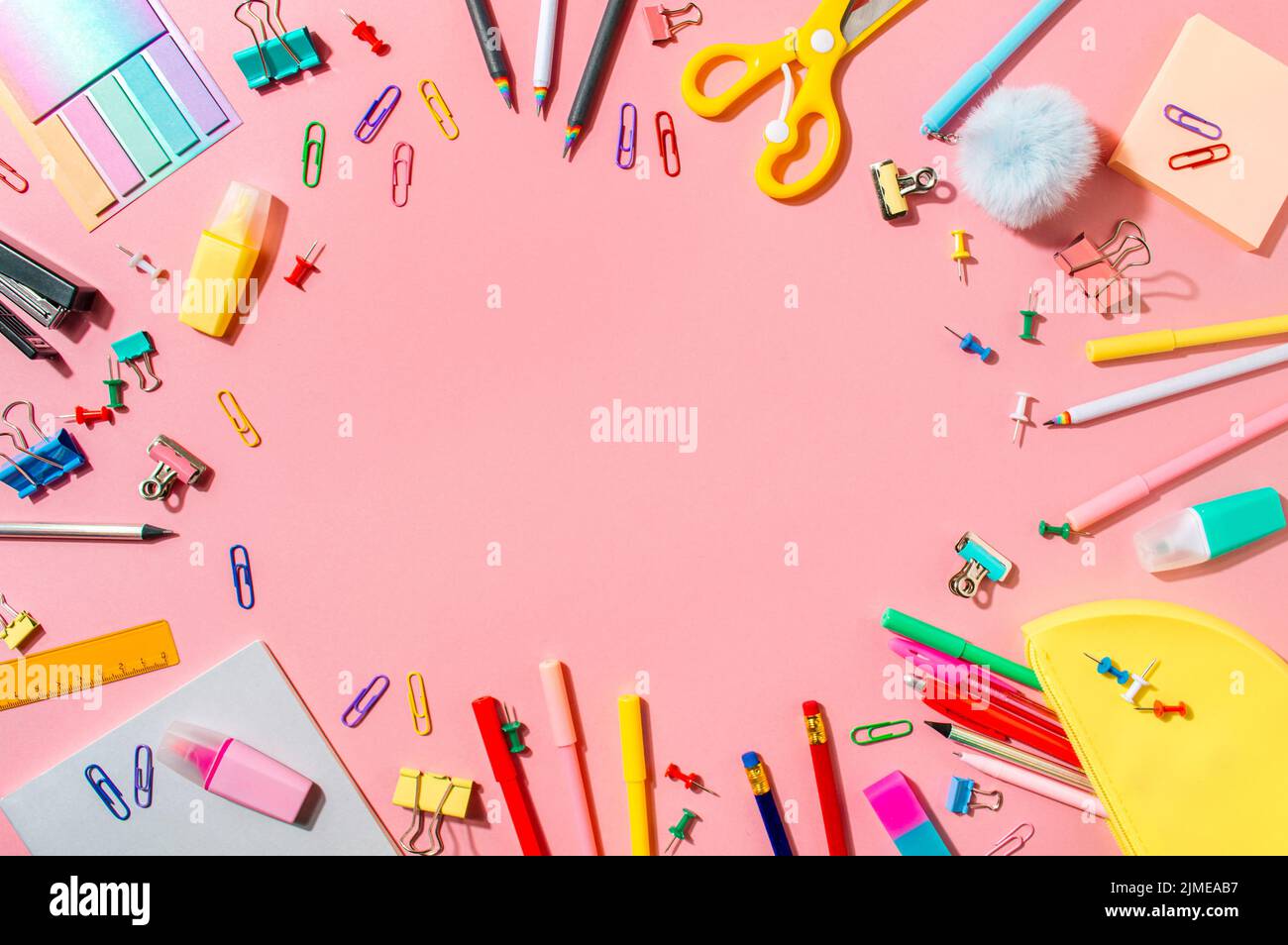 Back to school concept. Copy space. Pink bg Stock Photo - Alamy