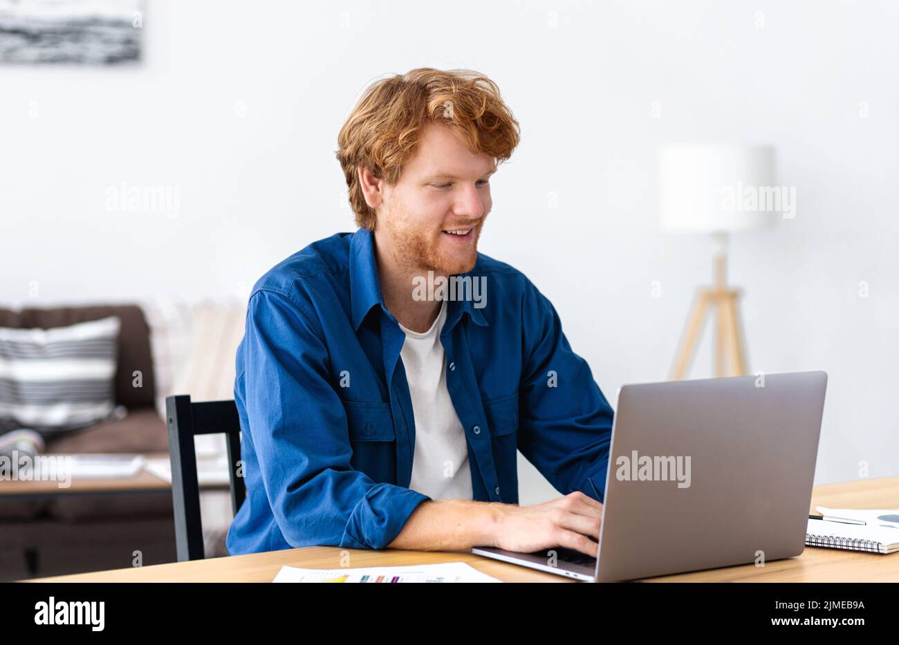 Young business owner man working using laptop Successful businessman typing on the keyboard Stock Photo