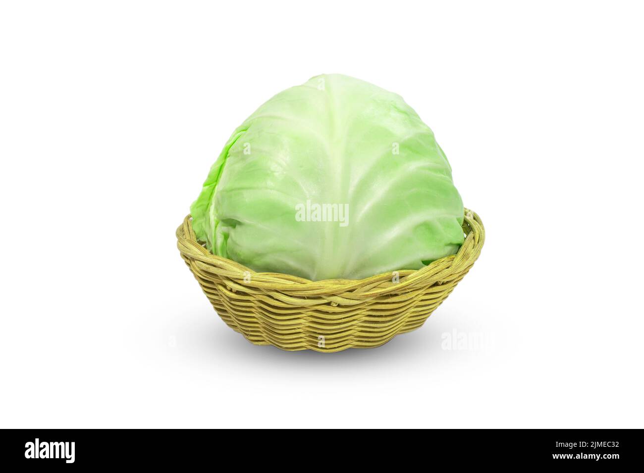 Fresh cabbage closeup the brown basket, isolated on white background Stock Photo