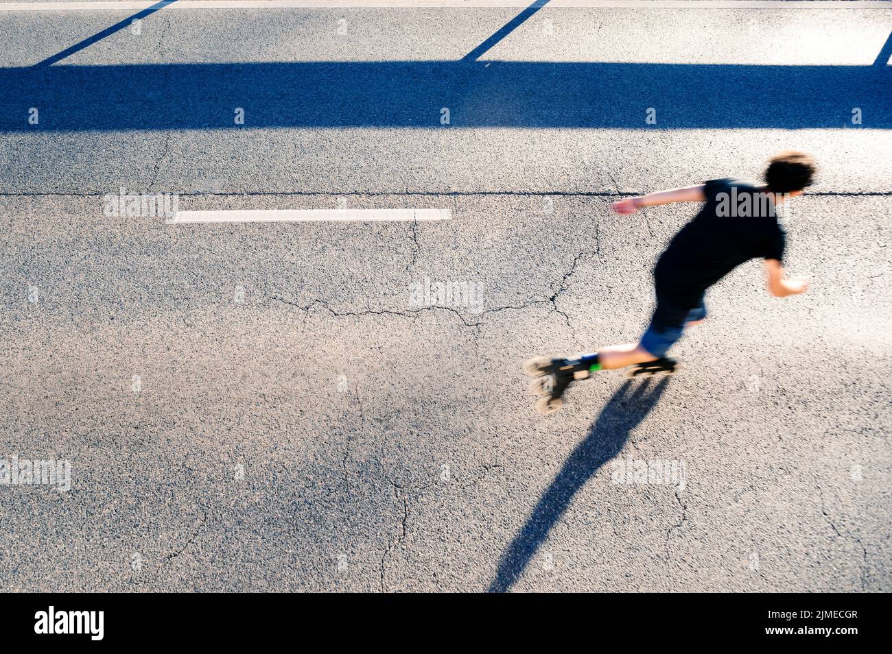 Person riding roller skates outdoors, top view Stock Photo