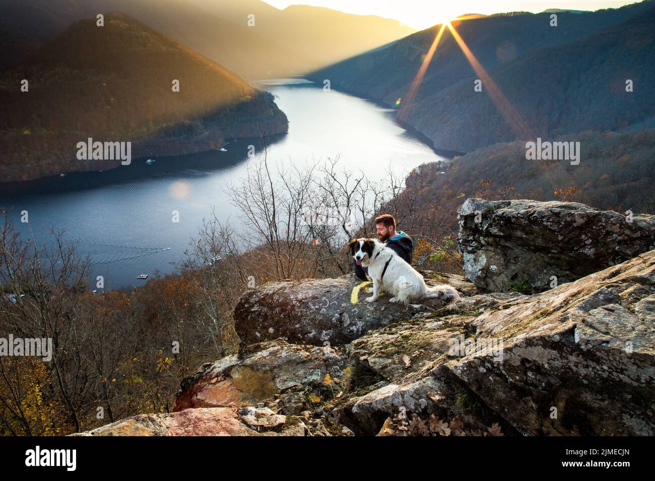 Man sitting rock lake hi-res stock photography and images - Alamy