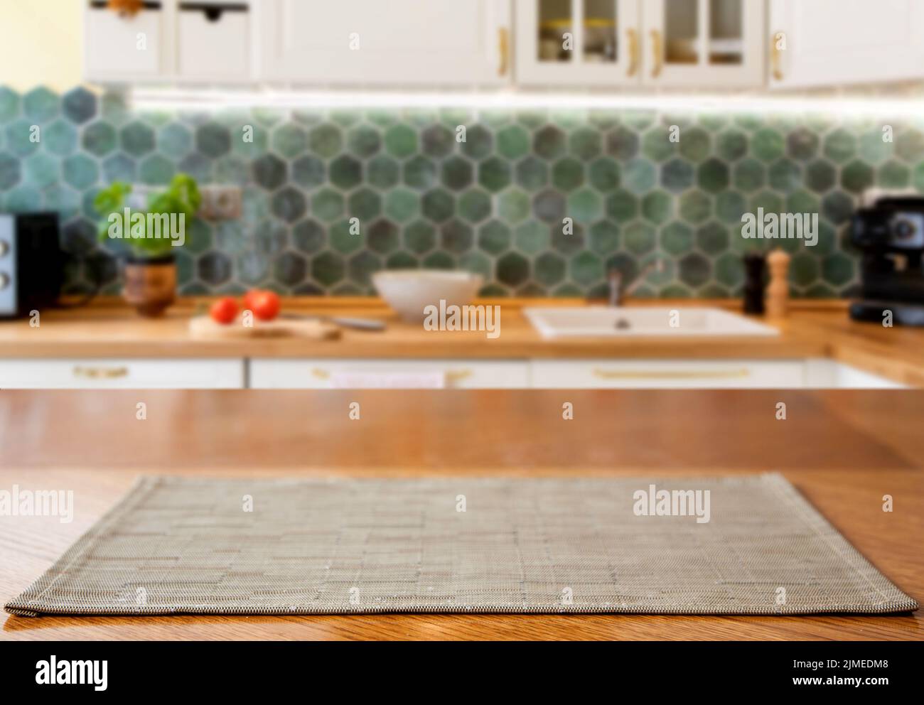 Blurred kitchen interior and wooden desk space home background Stock Photo