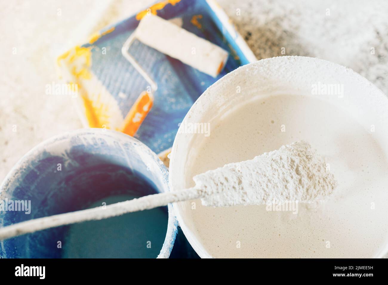 The concept of repair of the house and premises. Buckets of paint and