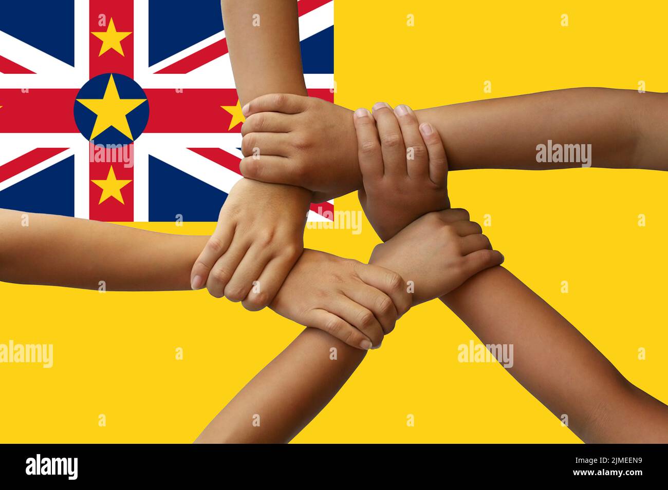 Niue flag, intergration of a multicultural group of young people Stock Photo