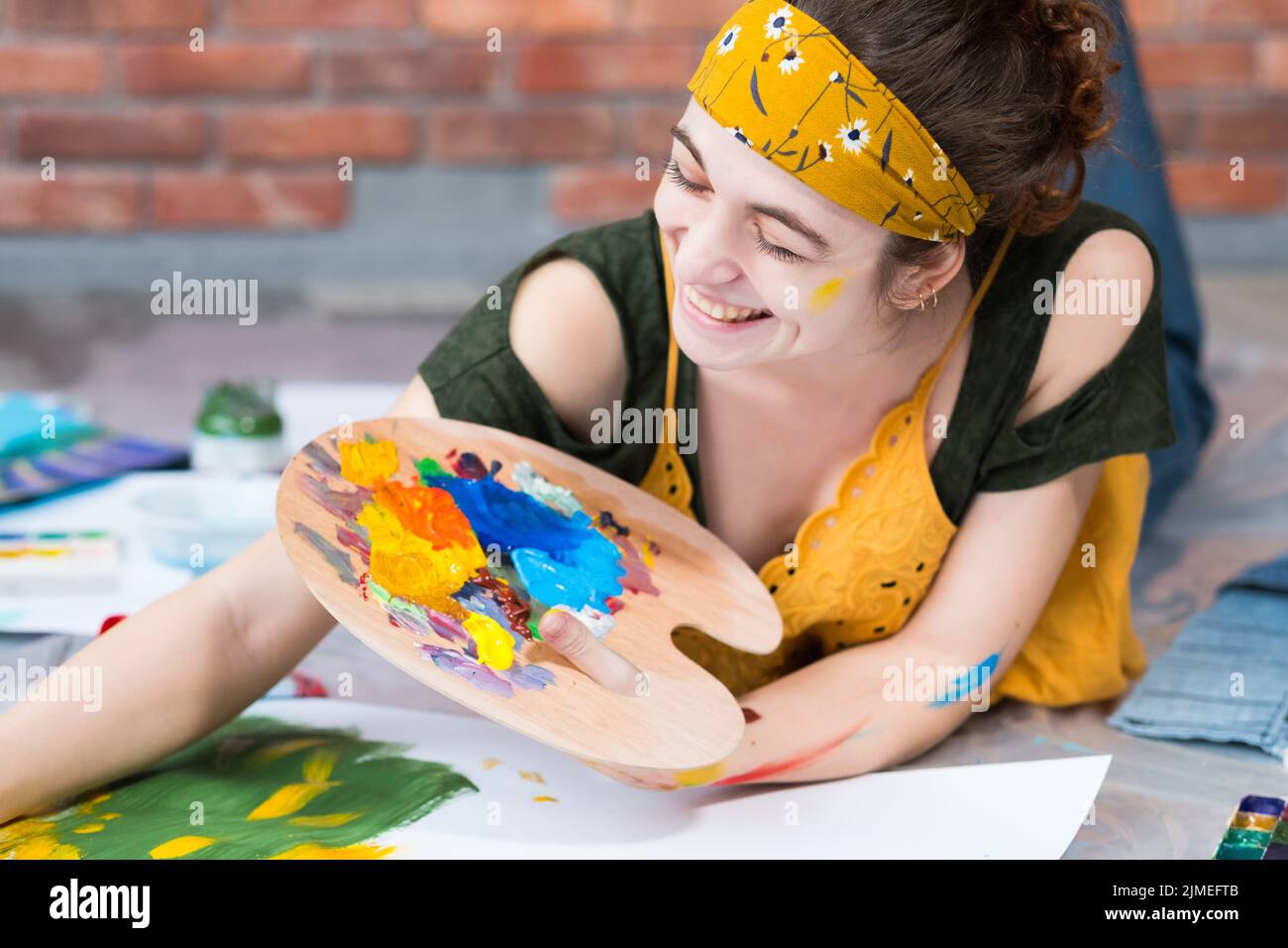 home art studio happy female painter palette Stock Photo - Alamy
