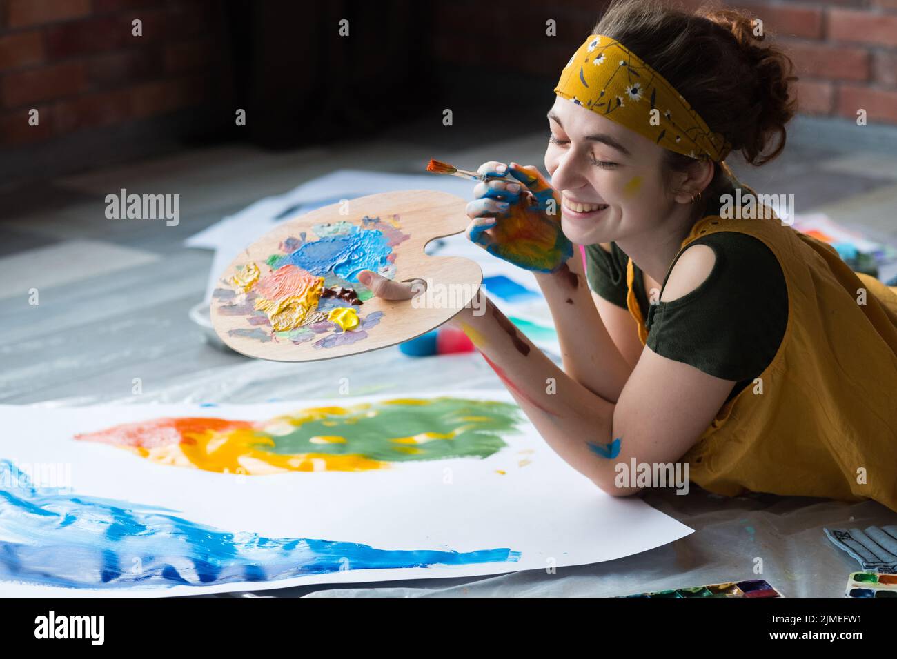 home art studio happy female painter palette Stock Photo - Alamy