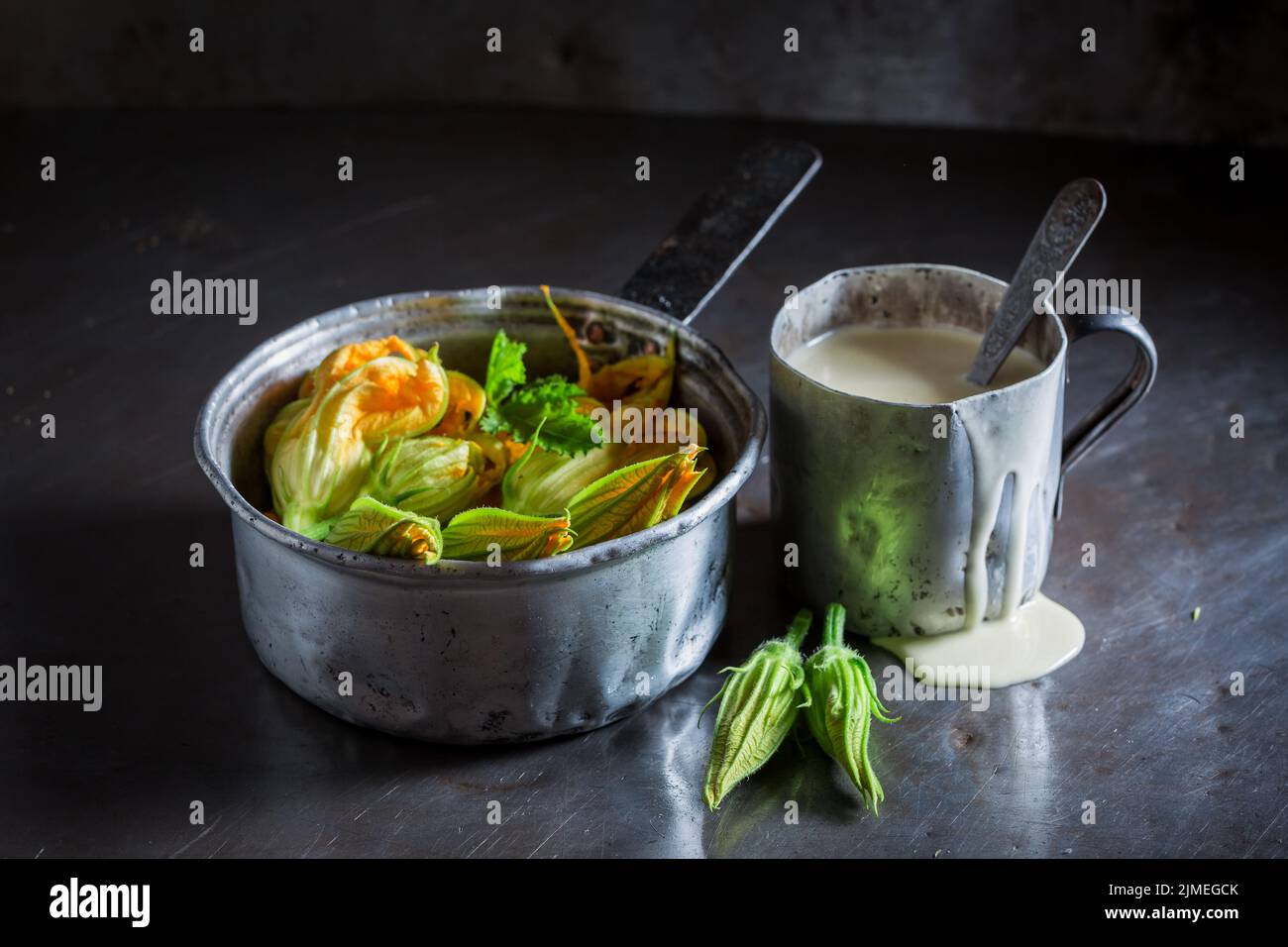 Preparation for roasted zucchini flower made of pancake batter. Pumpkin