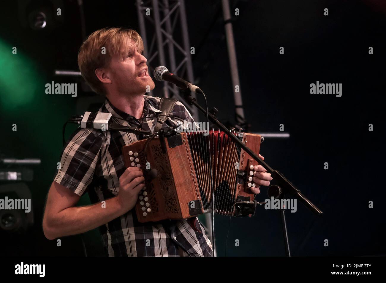 Wickham, UK. 05th Aug, 2022. Maxwell Thomas, melodeon, mandolin, and vocalist with folk punk band Skinny Lister performs live on stage at Wickham Festival, Hampshire. Skinny Lister are a British folk band formed in London in 2009. Initially performing as a five-piece band until October 2013 when a drummer was added. They are signed to Xtra Mile Recordings, and were previously signed to Sunday Best Records in the UK, SideOneDummy Records in the US and Uncle Owen Records in Japan. (Photo by Dawn Fletcher-Park/SOPA Images/Sipa USA) Credit: Sipa USA/Alamy Live News Stock Photo