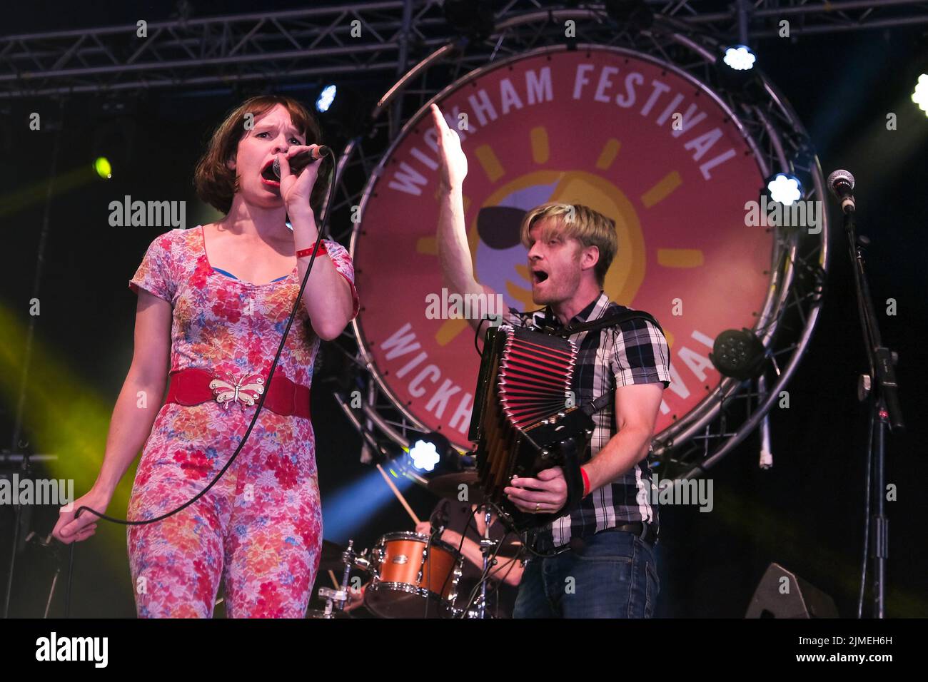 Wickham, UK. 05th Aug, 2022. Siblings Lorna Thomas, vocalist and Maxwell Thomas melodeon, mandolin, vocals with folk punk band Skinny Lister perform live on stage at Wickham Festival. Skinny Lister are a British folk band formed in London in 2009. Initially performing as a five-piece band until October 2013 when a drummer was added. They are signed to Xtra Mile Recordings, and were previously signed to Sunday Best Records in the UK, SideOneDummy Records in the US and Uncle Owen Records in Japan. Credit: SOPA Images Limited/Alamy Live News Stock Photo
