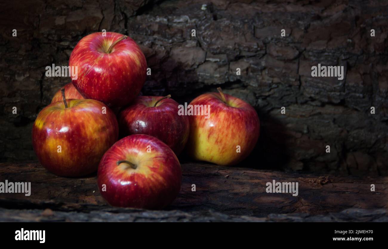 Group of red apples on dark rustic background Stock Photo