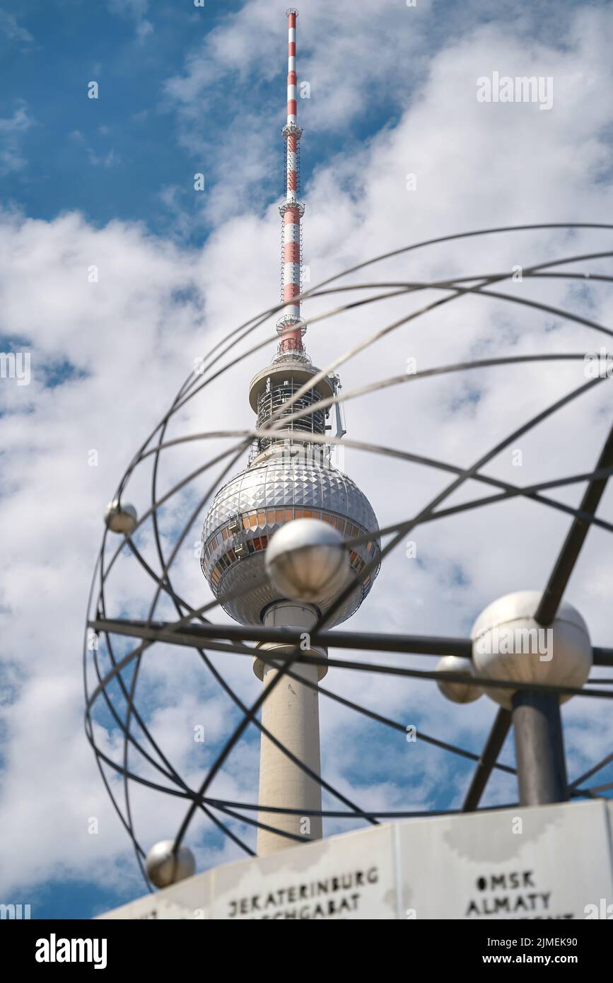 View of the television tower in Berlin. In the foreground parts of the world clock. Stock Photo