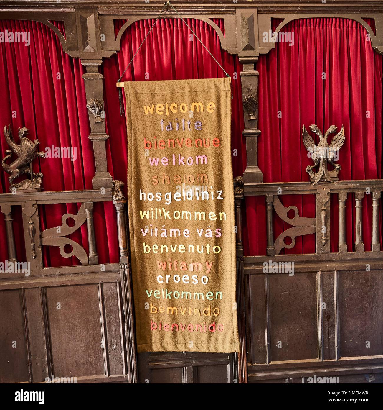Multi-lingual welcome tapestry in St Chad's Church,Poulton-Le-Fylde Stock Photo