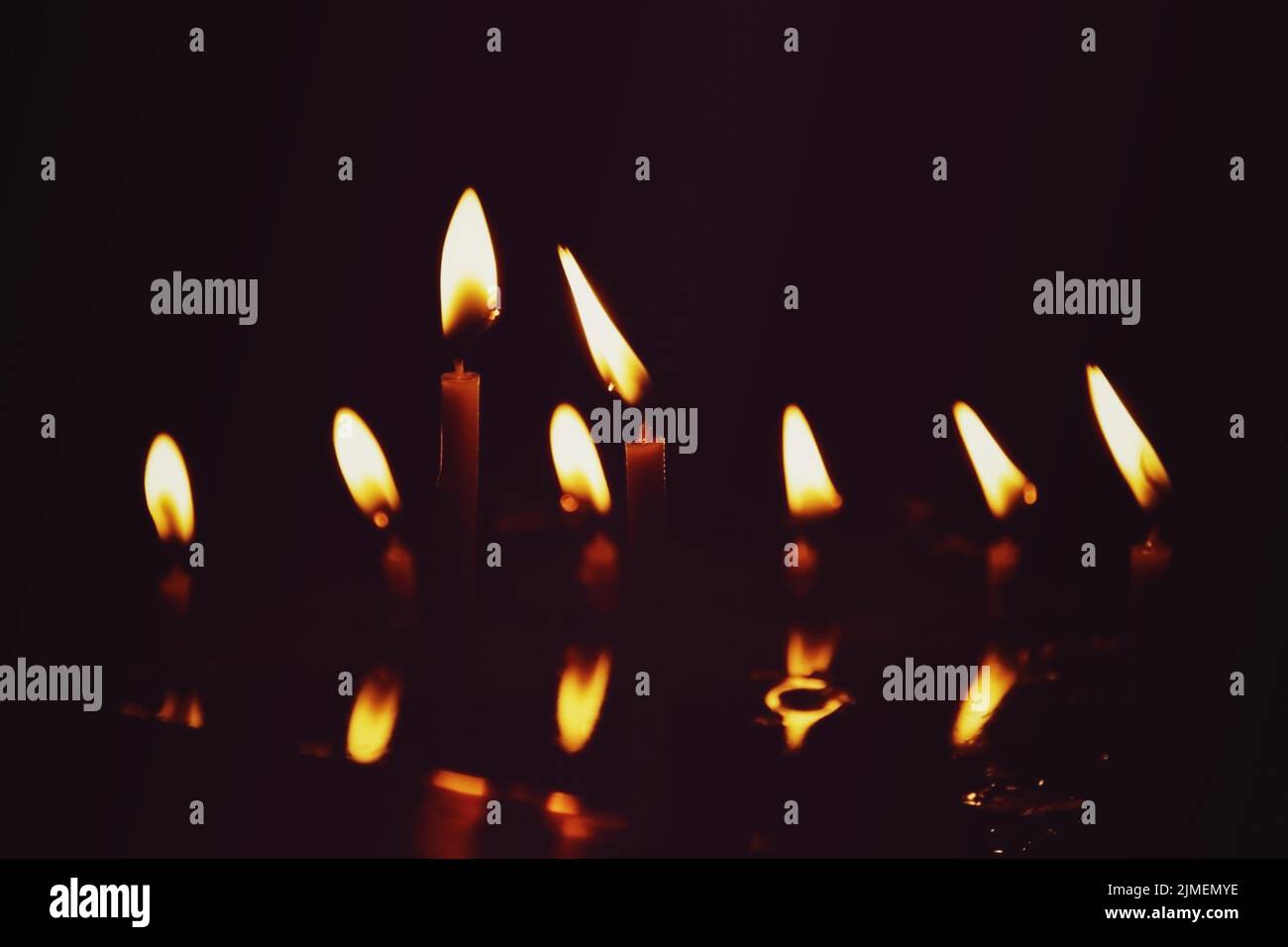 Prayer candles burning in the dark church Stock Photo Alamy